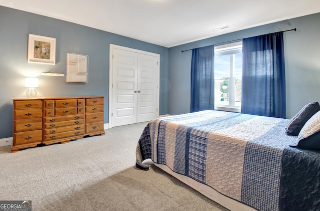 bedroom with a closet and carpet