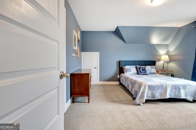 bedroom with light colored carpet