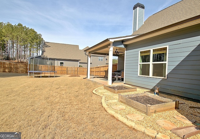 view of yard featuring a trampoline