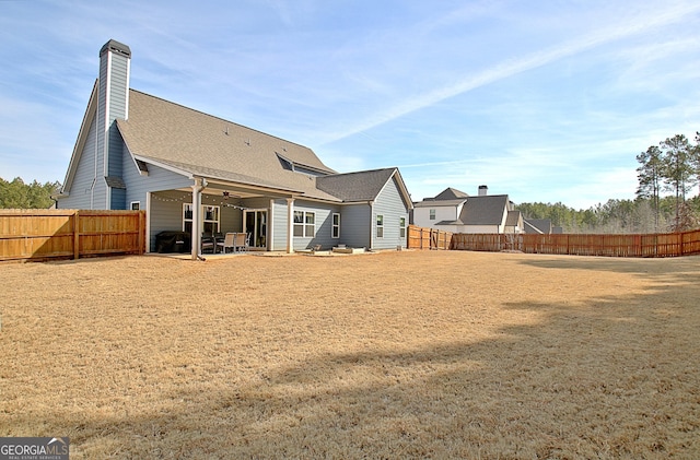 rear view of property featuring a patio