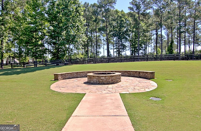 view of yard with a patio area and a fire pit