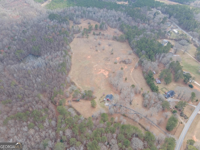 birds eye view of property with a rural view
