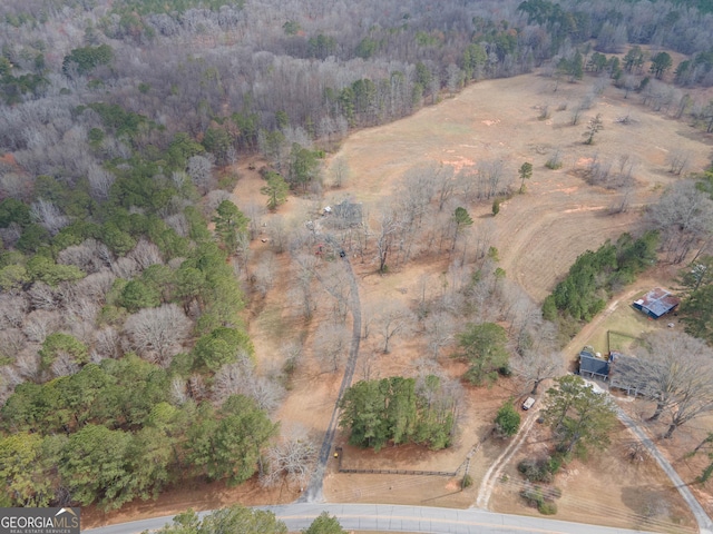 bird's eye view featuring a forest view