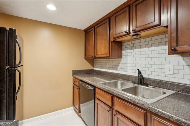 kitchen with backsplash, sink, and black appliances