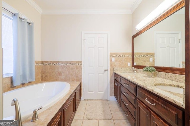 bathroom with tile patterned flooring, ornamental molding, vanity, and a bathtub