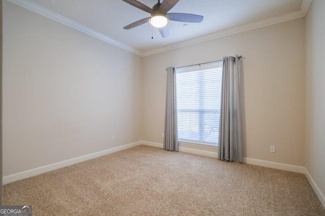 carpeted spare room with crown molding and ceiling fan