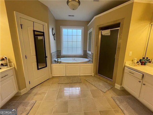 bathroom with vanity, separate shower and tub, and tile patterned floors