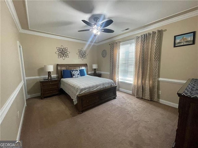 bedroom with ornamental molding, ceiling fan, and carpet flooring