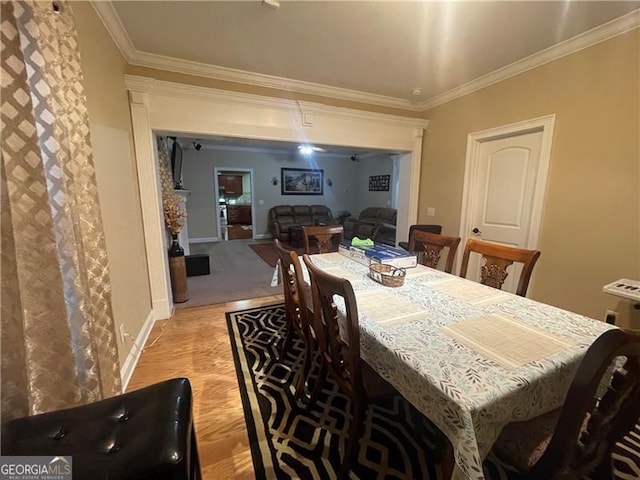 dining area with crown molding