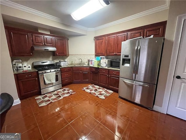 kitchen with sink, crown molding, dark tile patterned floors, stainless steel appliances, and decorative backsplash