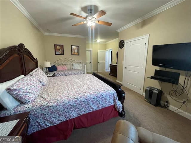 carpeted bedroom featuring crown molding and ceiling fan