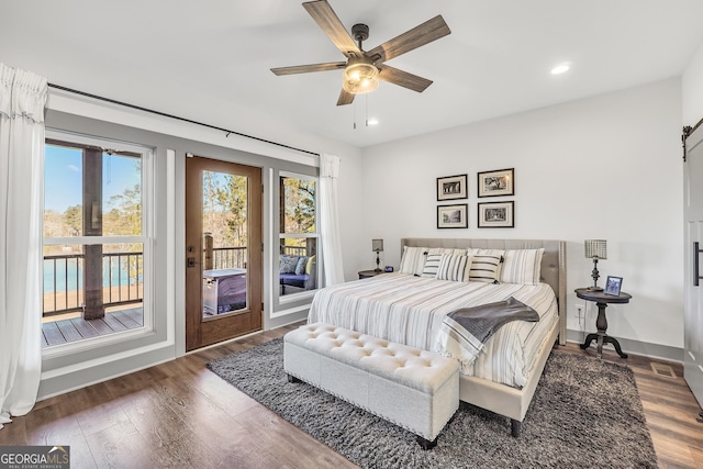 bedroom featuring access to outside, dark hardwood / wood-style floors, and ceiling fan