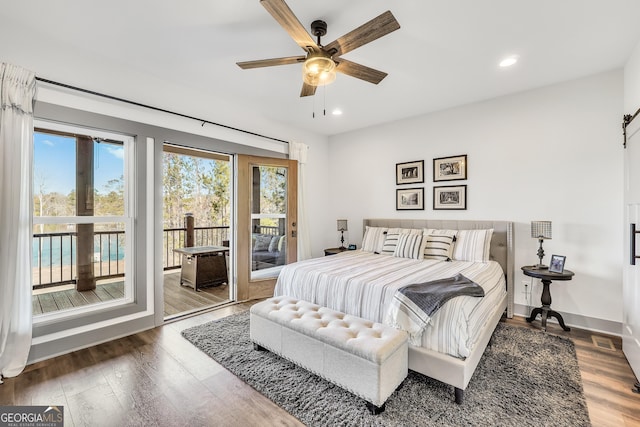 bedroom featuring access to exterior, dark hardwood / wood-style floors, and ceiling fan