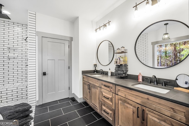 bathroom with vanity, tile patterned floors, and walk in shower