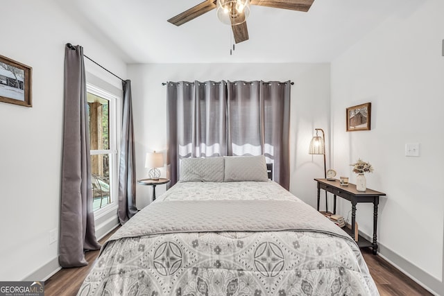 bedroom featuring dark wood-type flooring and ceiling fan