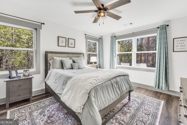 bedroom featuring dark wood-type flooring and ceiling fan