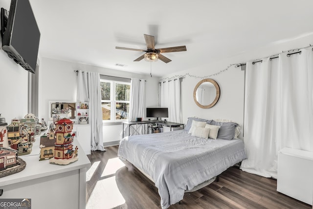 bedroom featuring dark wood-type flooring and ceiling fan