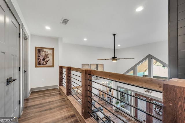 corridor with dark hardwood / wood-style floors