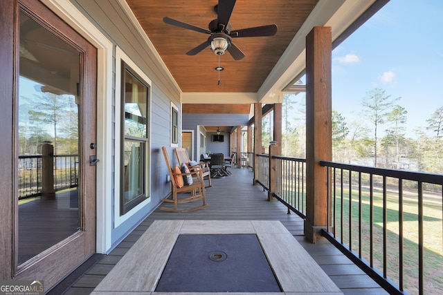 wooden deck with ceiling fan