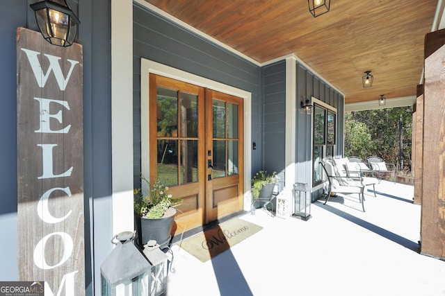 view of patio with french doors and covered porch