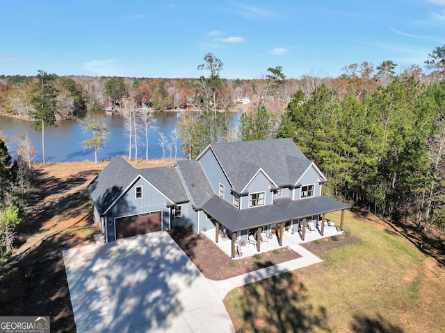 birds eye view of property with a water view