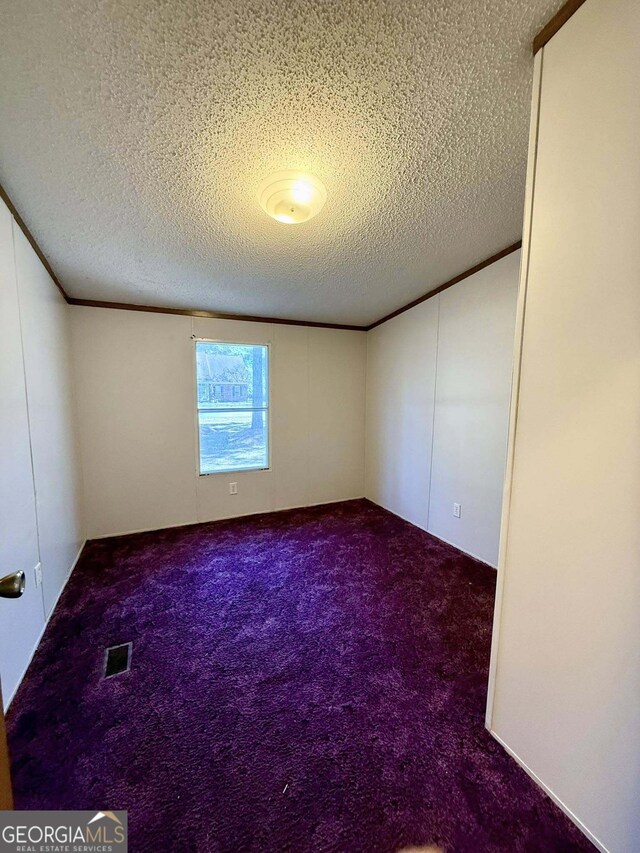 washroom with cabinets, hookup for a washing machine, dark hardwood / wood-style floors, and a textured ceiling