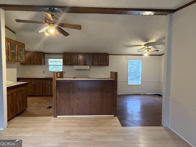 kitchen featuring a textured ceiling, light hardwood / wood-style flooring, and ceiling fan