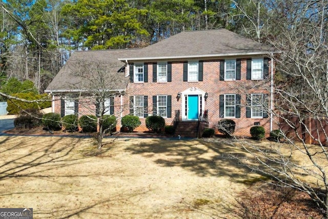 colonial house with a front lawn