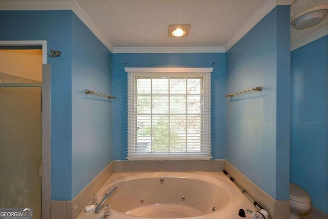 bathroom featuring crown molding, a bathtub, and toilet