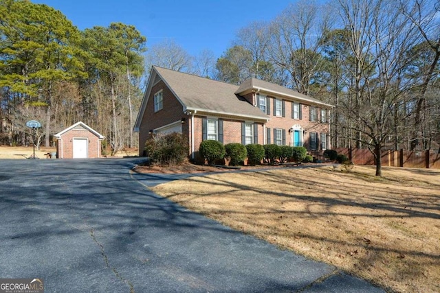 view of front of property with an outbuilding and a garage