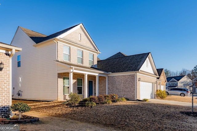 view of front property featuring a garage and covered porch