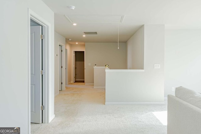 hallway with light colored carpet