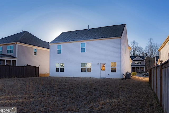 rear view of property featuring central AC