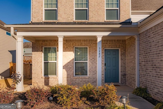 entrance to property featuring covered porch