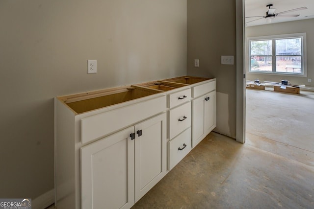 bathroom with concrete floors and a ceiling fan