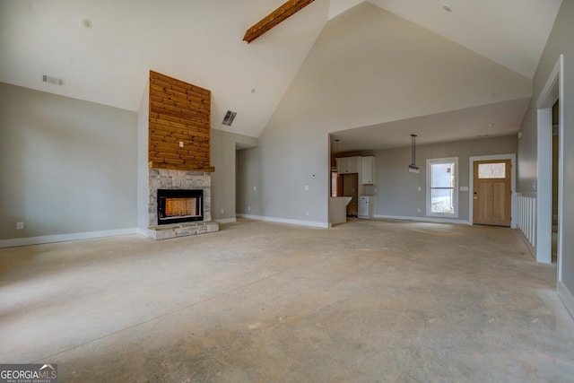 unfurnished living room featuring baseboards, visible vents, concrete floors, high vaulted ceiling, and a stone fireplace