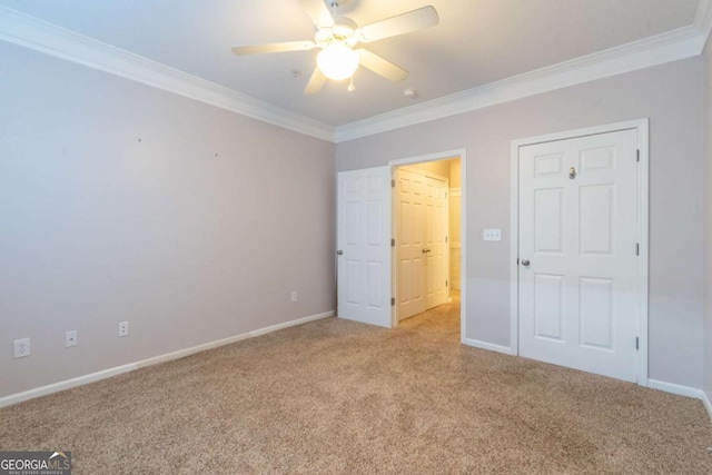 unfurnished bedroom featuring light carpet, ornamental molding, and ceiling fan