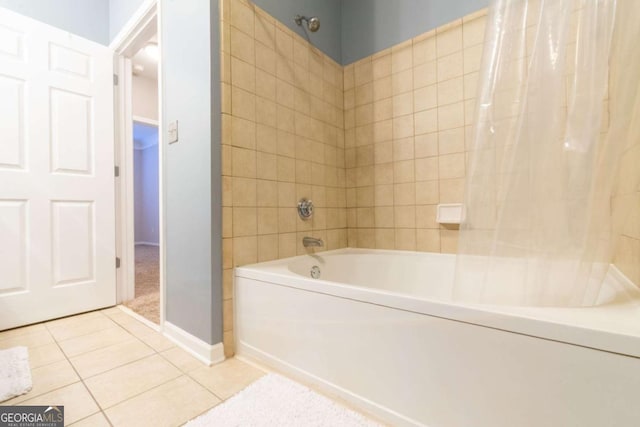 bathroom with tile patterned floors and shower / bathtub combination with curtain