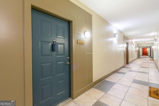 corridor with light tile patterned flooring