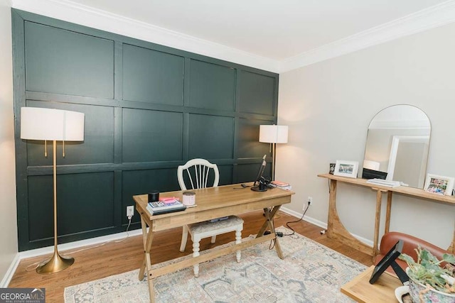 office area featuring crown molding and light hardwood / wood-style flooring