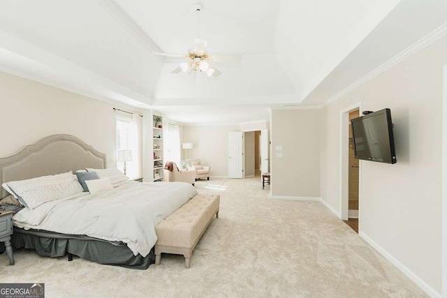 carpeted bedroom with crown molding, ceiling fan, and a raised ceiling