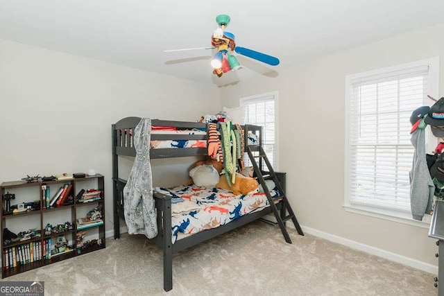 carpeted bedroom with ceiling fan