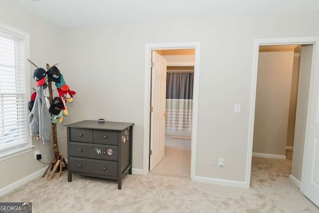 carpeted bedroom with ensuite bathroom