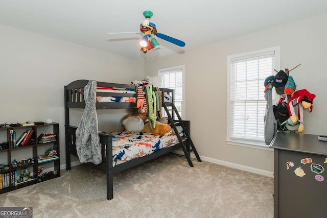 bedroom featuring light carpet and ceiling fan