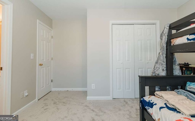 carpeted bedroom featuring a closet