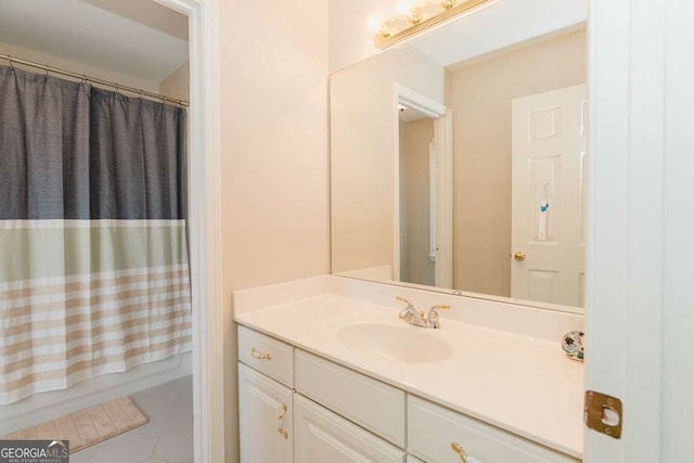 bathroom with tile patterned flooring, vanity, and shower / tub combo