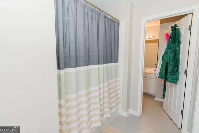 bathroom featuring tile patterned floors and vanity