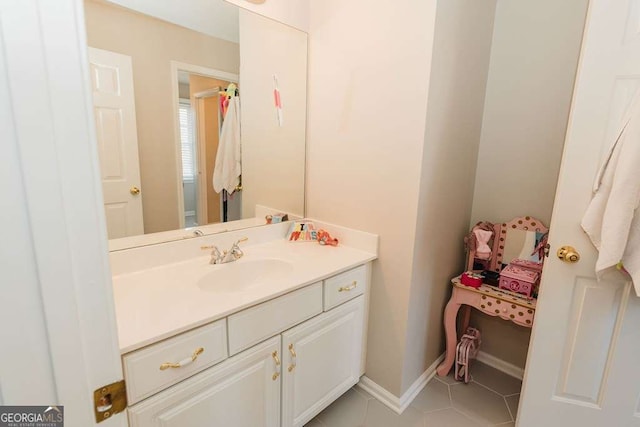 bathroom with tile patterned flooring and vanity