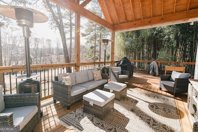 deck with an outdoor living space and grilling area