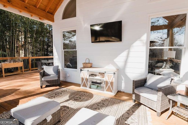 sunroom / solarium with lofted ceiling and wooden ceiling